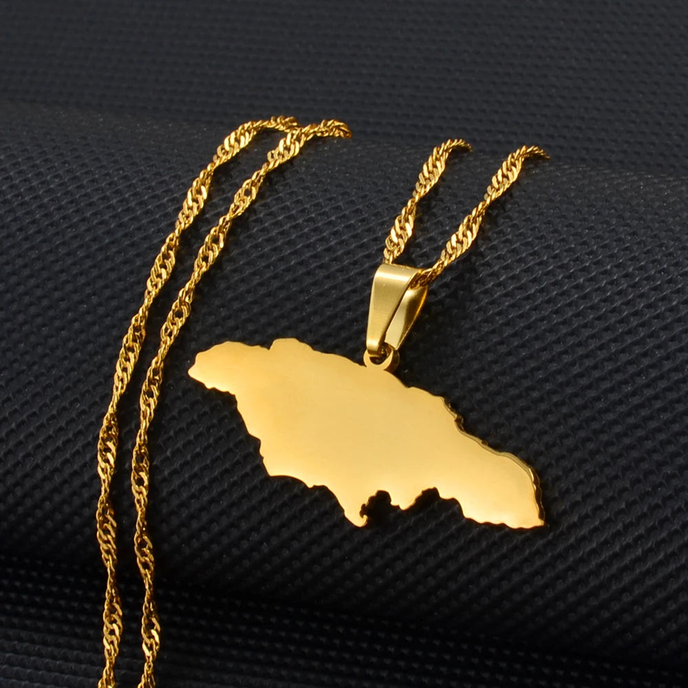 Gold necklace with a Jamaica map pendant on a black textured background